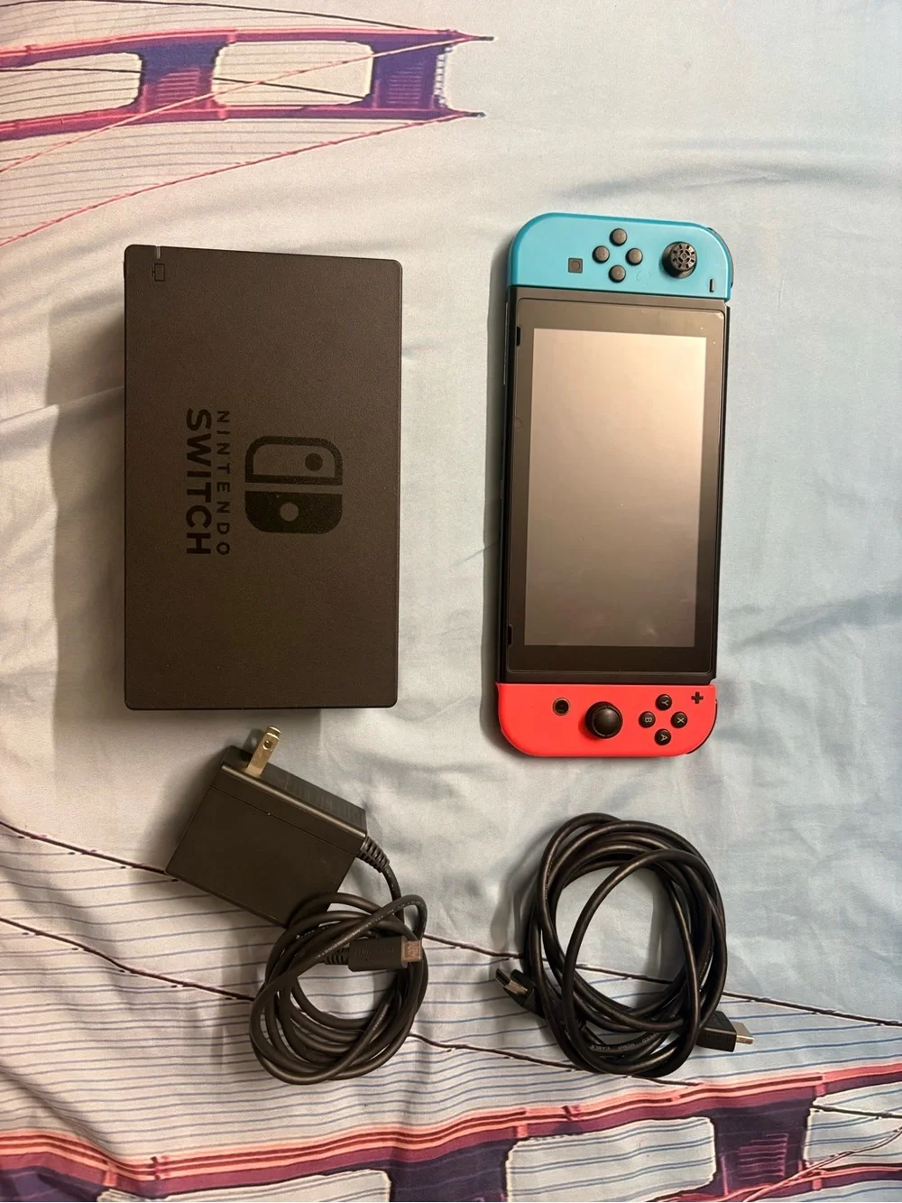 Nintendo Switch with Neon Red Right Joy‑Con and Neon Blue Left Joy‑Con
